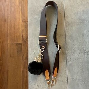 Bag strap with charm